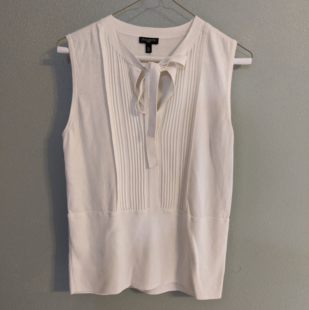 White sleeveless sweater blouse